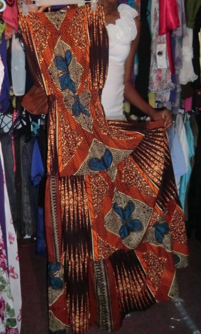 A client checks out a Kitenge dress at Kiki's