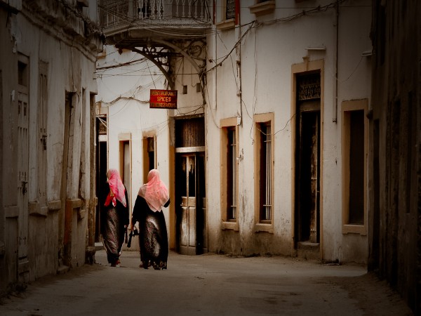 Tanzania's Marvels - Two Muslim women walk in the streets of Zanzibar